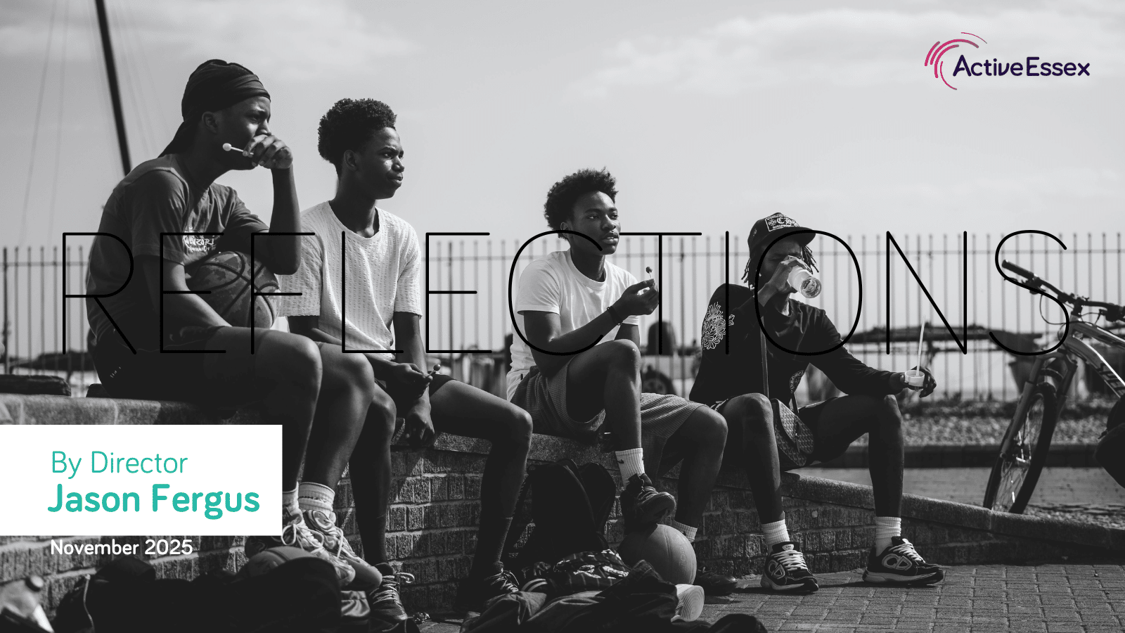 A group of young black men hanging out at the park with their bikes
